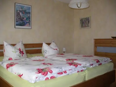 Ein Bett oder Betten in einem Zimmer der Unterkunft Ferienwohnung Herrig
