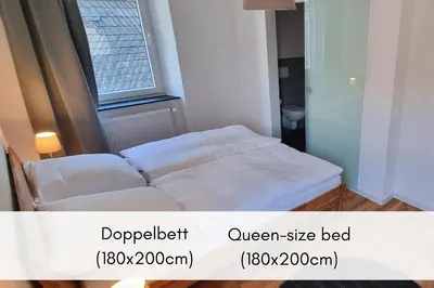 Ein Bett oder Betten in einem Zimmer der Unterkunft Winzerhaus am Calmont - Historisches Mosel-Refugium