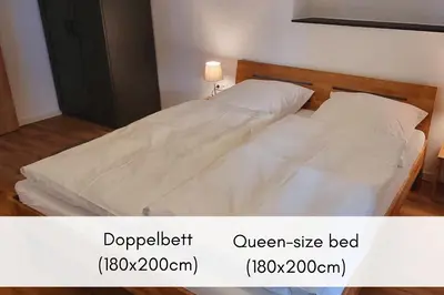 Ein Bett oder Betten in einem Zimmer der Unterkunft Winzerhaus am Calmont - Moselidyll im Winzerhaus
