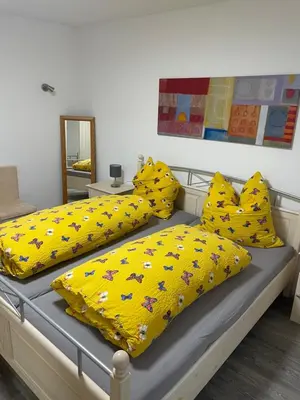 Ein Bett oder Betten in einem Zimmer der Unterkunft Ferienwohnung Traumschleife Klettersteig
