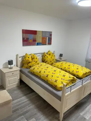 Ein Bett oder Betten in einem Zimmer der Unterkunft Ferienwohnung Traumschleife Klettersteig