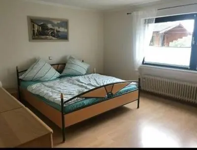 Ein Bett oder Betten in einem Zimmer der Unterkunft Am Mühlenberg