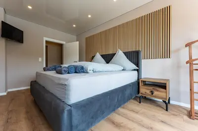 Ein Bett oder Betten in einem Zimmer der Unterkunft Moselresidenz Bellevue Alf