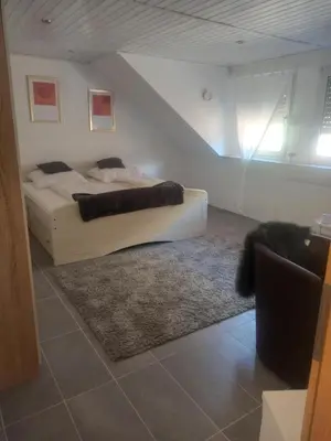 Ein Bett oder Betten in einem Zimmer der Unterkunft Riesling
