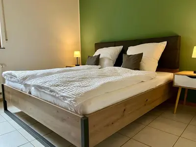 Ein Bett oder Betten in einem Zimmer der Unterkunft Ferienapartments Eifel Stay