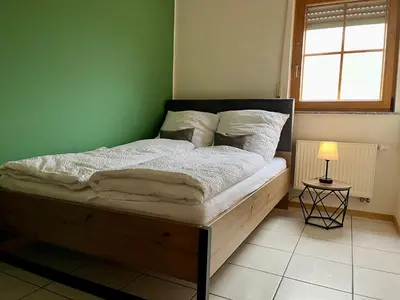 Ein Bett oder Betten in einem Zimmer der Unterkunft Ferienapartments Eifel Stay