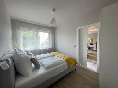 Ein Bett oder Betten in einem Zimmer der Unterkunft Das Haus am Weinberg
