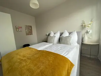 Ein Bett oder Betten in einem Zimmer der Unterkunft Das Haus am Weinberg