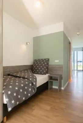 Ein Bett oder Betten in einem Zimmer der Unterkunft B - HOME Apartments