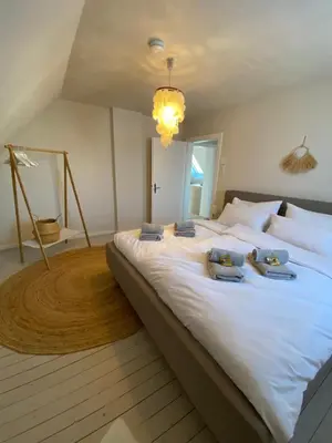 Ein Bett oder Betten in einem Zimmer der Unterkunft Cozy City Apartment Daun - Ferienwohnung