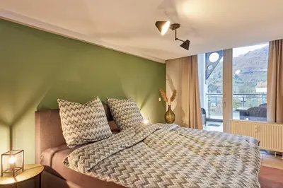 Ein Bett oder Betten in einem Zimmer der Unterkunft Penthouse Palais Mosel
