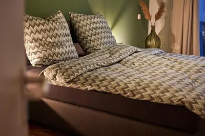 Ein Bett oder Betten in einem Zimmer der Unterkunft Penthouse Palais Mosel