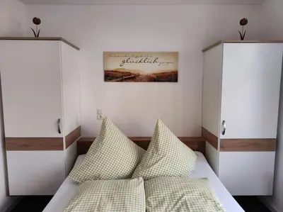 Ein Bett oder Betten in einem Zimmer der Unterkunft Else' s Stübchen