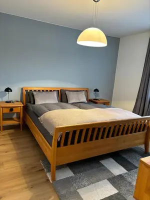 Ein Bett oder Betten in einem Zimmer der Unterkunft Ferienapartment Auszeit- Sauna, Whirlpool und Garten zur Alleinnutzung