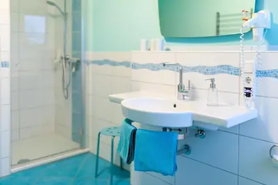 Ein Badezimmer in der Unterkunft Ferienwohnungen Landgasthaus Janshen