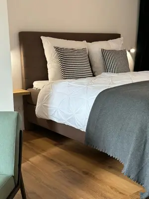 Ein Bett oder Betten in einem Zimmer der Unterkunft Flussbett - Appartement an der Mosel