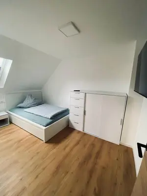 Ein Bett oder Betten in einem Zimmer der Unterkunft Ferienhaus Bleckhausen