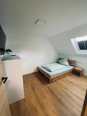 Ein Bett oder Betten in einem Zimmer der Unterkunft Ferienhaus Bleckhausen