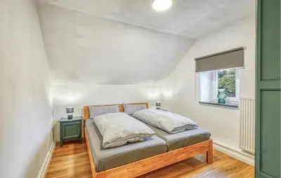 Ein Bett oder Betten in einem Zimmer der Unterkunft Beautiful Home In Nimsreuland With Wifi