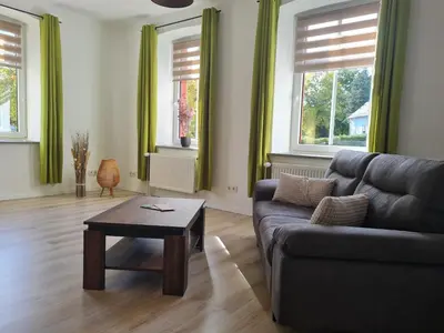 Ein Sitzbereich in der Unterkunft Ferienwohnung am Nationalpark Hunsrück Hochwald