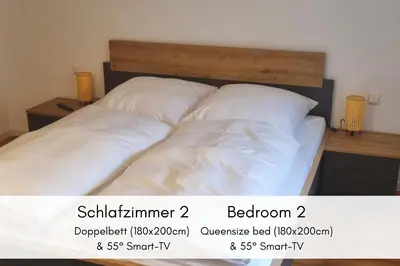 Ein Bett oder Betten in einem Zimmer der Unterkunft Winzerhaus am Calmont - Raumwunder mit Moselblick
