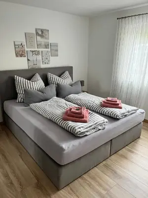 Ein Bett oder Betten in einem Zimmer der Unterkunft Ferienwohnung LINA