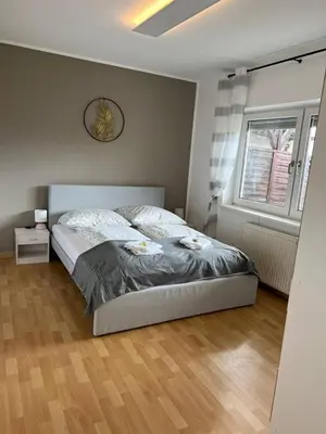 Ein Bett oder Betten in einem Zimmer der Unterkunft Gartenparadies Apartment in Urbar