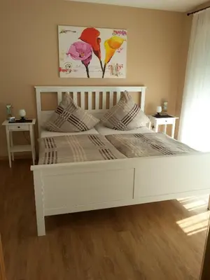 Ein Bett oder Betten in einem Zimmer der Unterkunft Ferienwohnung Weingut Ackermann