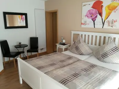 Ein Bett oder Betten in einem Zimmer der Unterkunft Ferienwohnung Weingut Ackermann