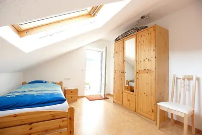 Ein Bett oder Betten in einem Zimmer der Unterkunft Ferienwohnung Weingut Ackermann
