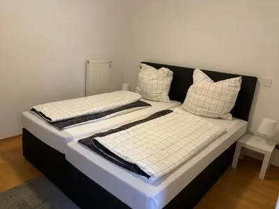 Ein Bett oder Betten in einem Zimmer der Unterkunft Ferienwohnung am Waldrand