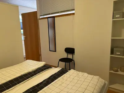 Ein Bett oder Betten in einem Zimmer der Unterkunft Ferienwohnung am Waldrand
