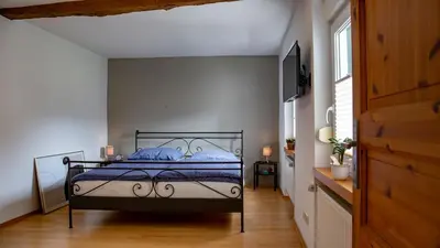 Ein Bett oder Betten in einem Zimmer der Unterkunft Ferienhaus zum Kompeskopf - mit Moselblick