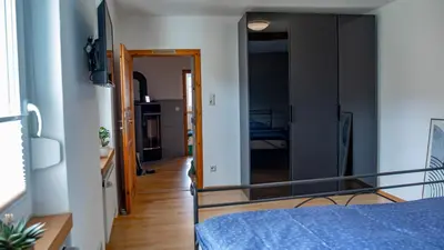 Ein Bett oder Betten in einem Zimmer der Unterkunft Ferienhaus zum Kompeskopf - mit Moselblick