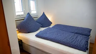 Ein Bett oder Betten in einem Zimmer der Unterkunft Ferienhaus zum Kompeskopf - mit Moselblick