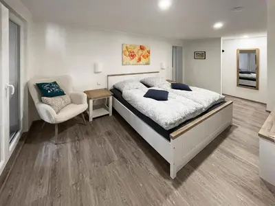 Ein Bett oder Betten in einem Zimmer der Unterkunft Ferienhaus Ty Maya