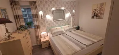 Ein Bett oder Betten in einem Zimmer der Unterkunft Moselburgblick