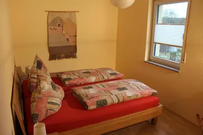 Ein Bett oder Betten in einem Zimmer der Unterkunft Ferienhaus Willwert