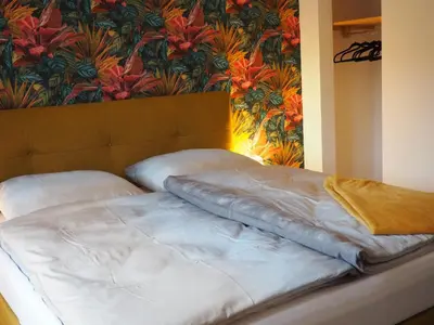 Ein Bett oder Betten in einem Zimmer der Unterkunft Ferienwohnung Sonnenseite