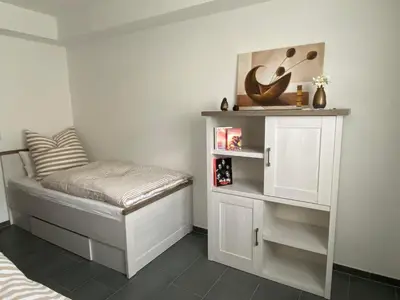 Ein Bett oder Betten in einem Zimmer der Unterkunft Ferienwohnung Flussufer No.12