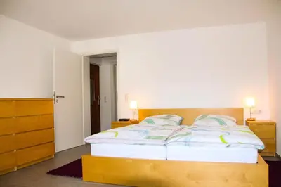 Ein Bett oder Betten in einem Zimmer der Unterkunft Ferienwohnungen Moselterrasse