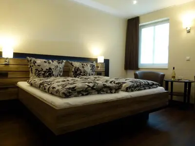 Ein Bett oder Betten in einem Zimmer der Unterkunft Ferienweingut Rudorfer