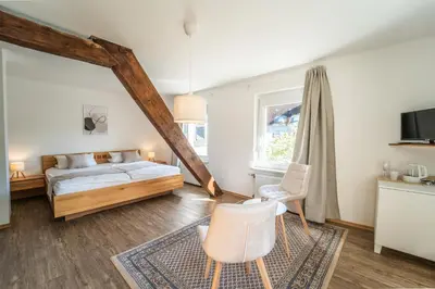 Ein Bett oder Betten in einem Zimmer der Unterkunft Gästehaus Mack - Mosel Rooms & Restaurant