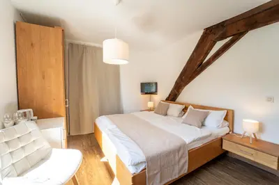 Ein Bett oder Betten in einem Zimmer der Unterkunft Gästehaus Mack - Mosel Rooms & Restaurant