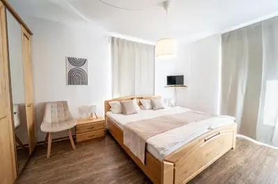 Ein Bett oder Betten in einem Zimmer der Unterkunft Gästehaus Mack - Mosel Rooms & Restaurant