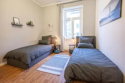 Ein Bett oder Betten in einem Zimmer der Unterkunft Südstadt-Oase 1 Komfort mit 2 SZ und Balkon