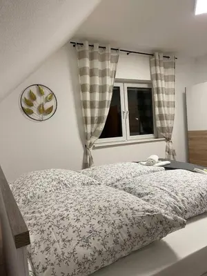 Ein Bett oder Betten in einem Zimmer der Unterkunft Rheinview Urbar Haus