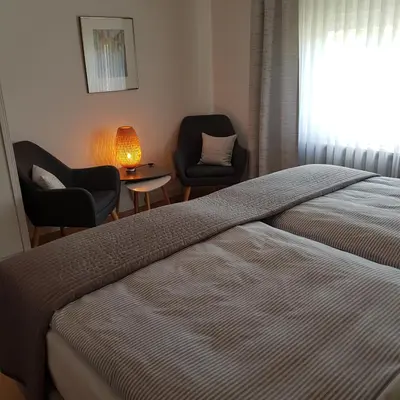 Ein Bett oder Betten in einem Zimmer der Unterkunft Ferienwohnung Brohltal-Aue