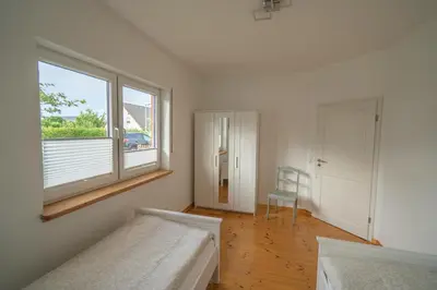 Ein Bett oder Betten in einem Zimmer der Unterkunft Ferienhaus Zum Feldblick