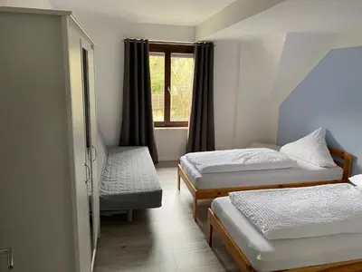 Ein Bett oder Betten in einem Zimmer der Unterkunft Ferienhaus Loreleytraum